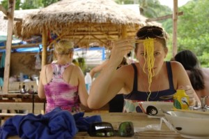 Trying a really spicy noodles on the beaches of Thailand