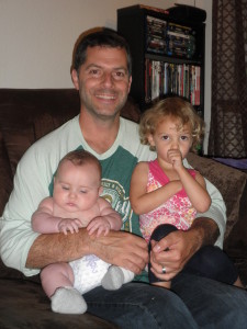 Nephew and Aunt sitting on Grandpa/Daddy's lap in Lacey, WA. June 2015