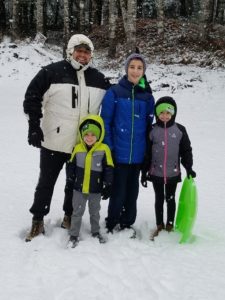 Family posing in the snow