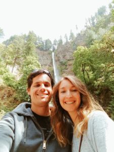 Kari with her husband in front of a waterfall