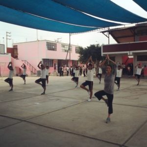 Daniela doing yoga with a local high school class in Peru