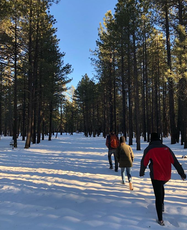 Ashley and cousins hiking in snow