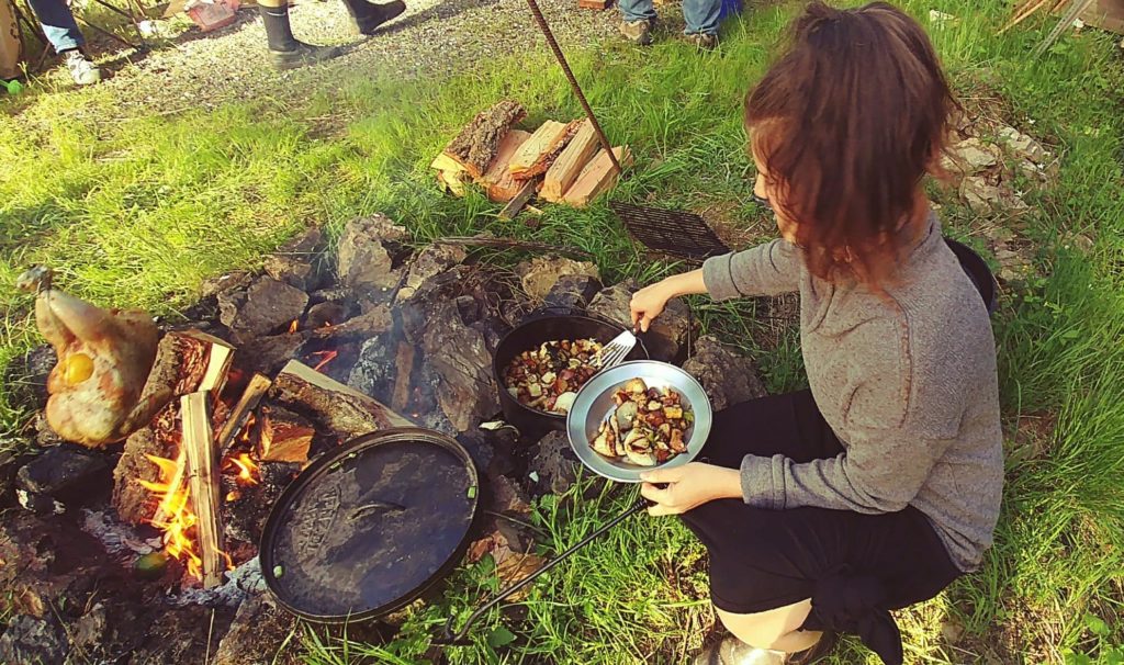 Ashley cooking over an open fire