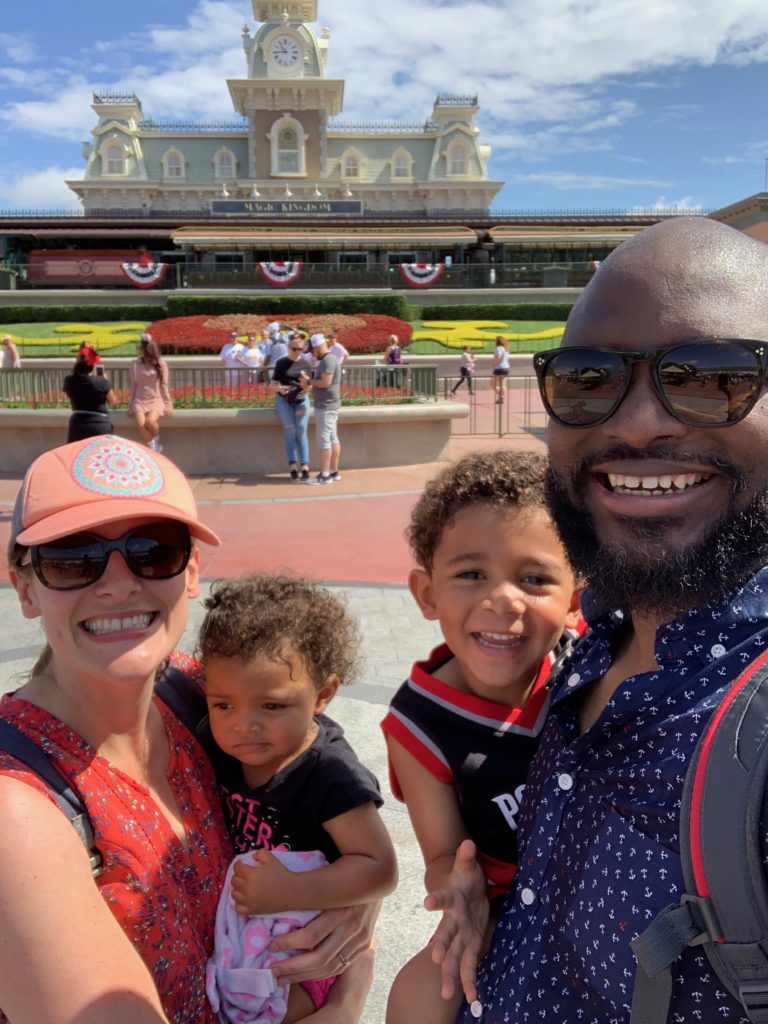 Heather with her husband and children at Disneyland